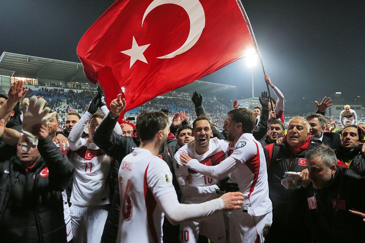 | Photo: AP/Visar Kryeziu : Turkeys players celebrate after winning the World Cup qualifying playoff final soccer match between Kosovo and Turkey in Pristina, Kosovo.