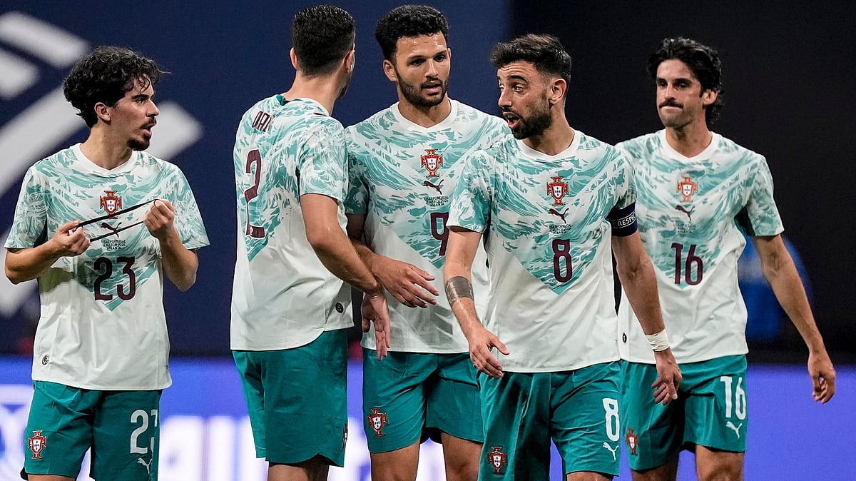 | Photo: AP/Mike Stewart : Portugal team mates celebrate a goal against the USA during the first half of an international friendly soccer match, Tuesday, March 31, 2026, in Atlanta.