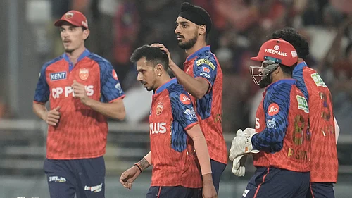 (AP Photo/Ashwini Bhatia) : Punjab Kings Yuzvendra Chahal , second from left, celebrates with teammates the wicket of Gujarat Titans captain Shubman Gill during the Indian Premier League cricket match between Gujarat Titans and Punjab Kings in New Chandigarh, India, Tuesday, March 31, 2026