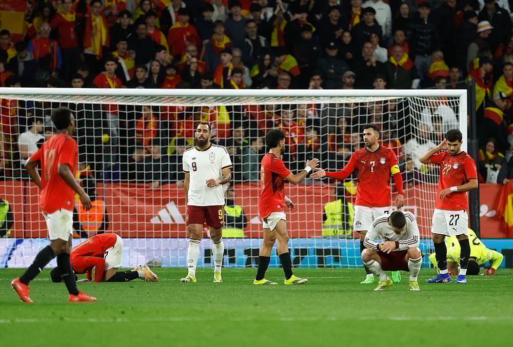 | Photo: AP/Joan Monfort : Spains and Egypt players react at the end of the international friendly soccer match between Spain and Egypt in Barcelona, Spain.