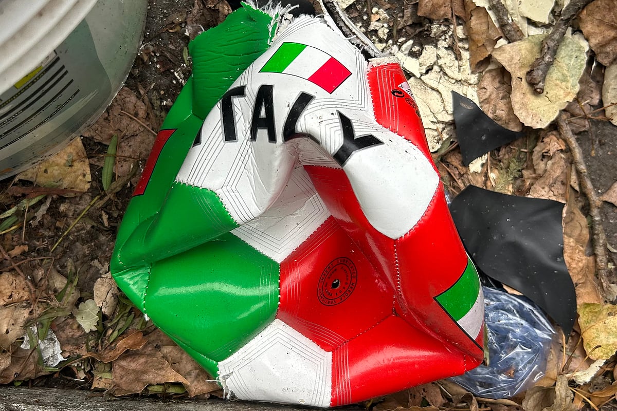 | Photo: AP/Gregorio Borgia : A broken soccer ball is pictured on a street in Rome, Wednesday, April 1, 2026.