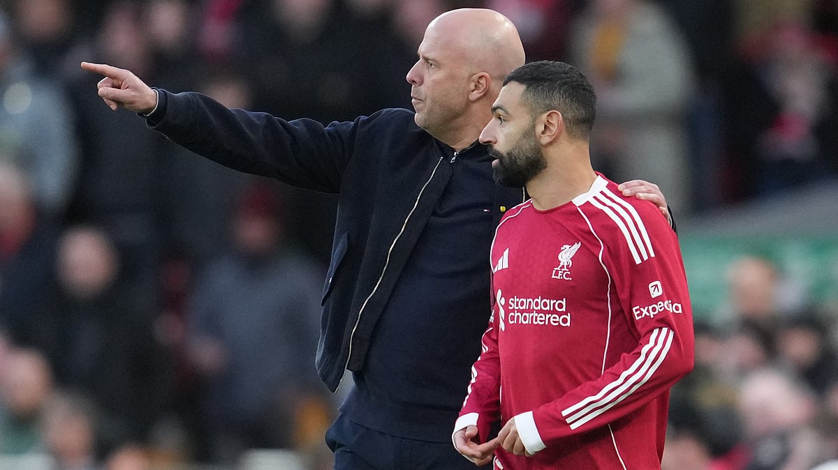 | Photo: AP/Jon Super : Liverpool's manager Arne Slot talks to Mohamed Salah during the Premier League soccer match between Liverpool and Tottenham in Liverpool, England, Sunday, March 15, 2026.