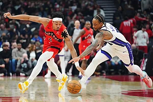 | Photo: Frank Gunn/The Canadian Press via AP : Toronto Raptors' Scottie Barnes (4) and Sacramento Kings' DeMar DeRozan (10) battle for the ball during the first half of an NBA basketball game in Toronto.