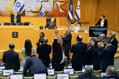 AP Photo/Itay Cohen : Israels Minister of National Security, Itamar Ben-Gvir, center, and lawmakers celebrate after Israels parliament passed a law approving the death penalty for Palestinians convicted of murdering Israelis, at the Knesset in Jerusalem Monday, March 30, 2026.