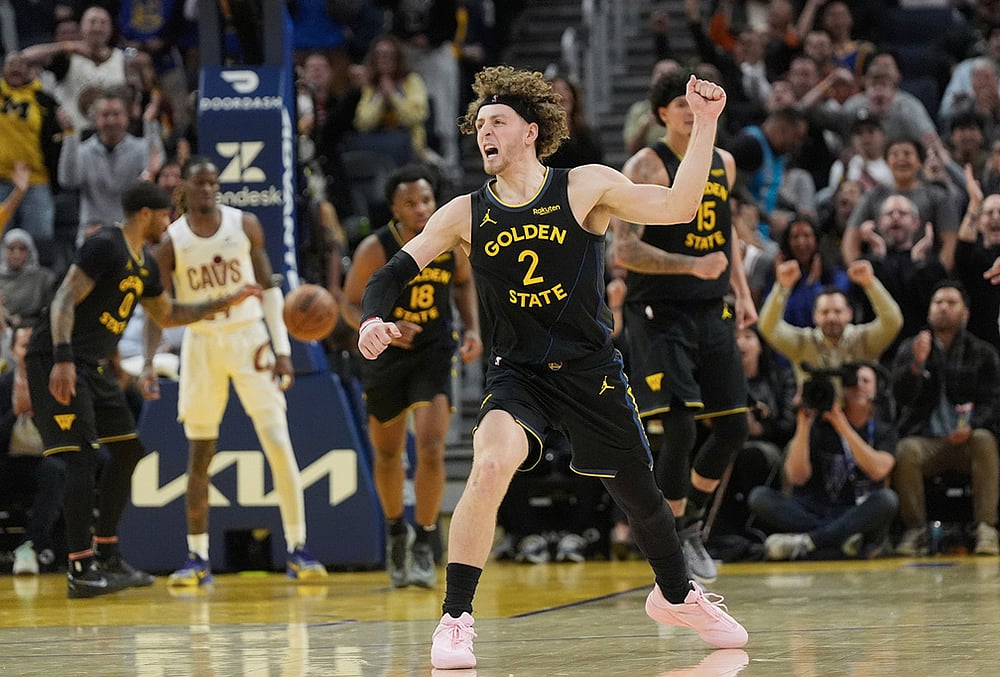 | Photo: AP/Jeff Chiu : Golden State Warriors guard Brandin Podziemski (2) celebrates after teammate forward Gui Santos scored against the Cleveland Cavaliers during the second half of an NBA basketball game in San Francisco.