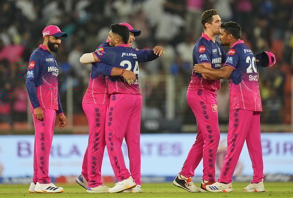 | Photo: AP/Ajit Solanki : Rajasthan Royals players celebrate after winning the Indian Premier League cricket match against Gujarat Titans in Ahmedabad.