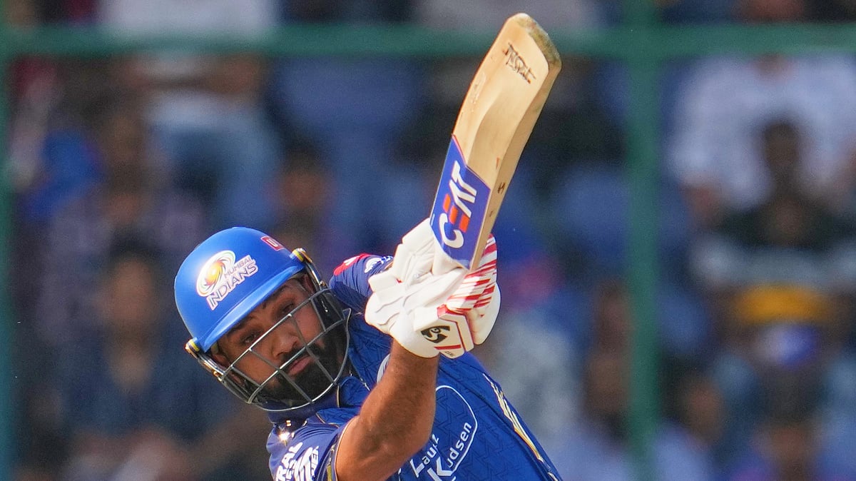 (AP Photo/Manish Swarup) : Mumbai Indians Rohit Sharma plays a shot during the Indian Premier League cricket match between Delhi Capitals and Mumbai Indians in New Delhi, India, Saturday, April. 4, 2026.