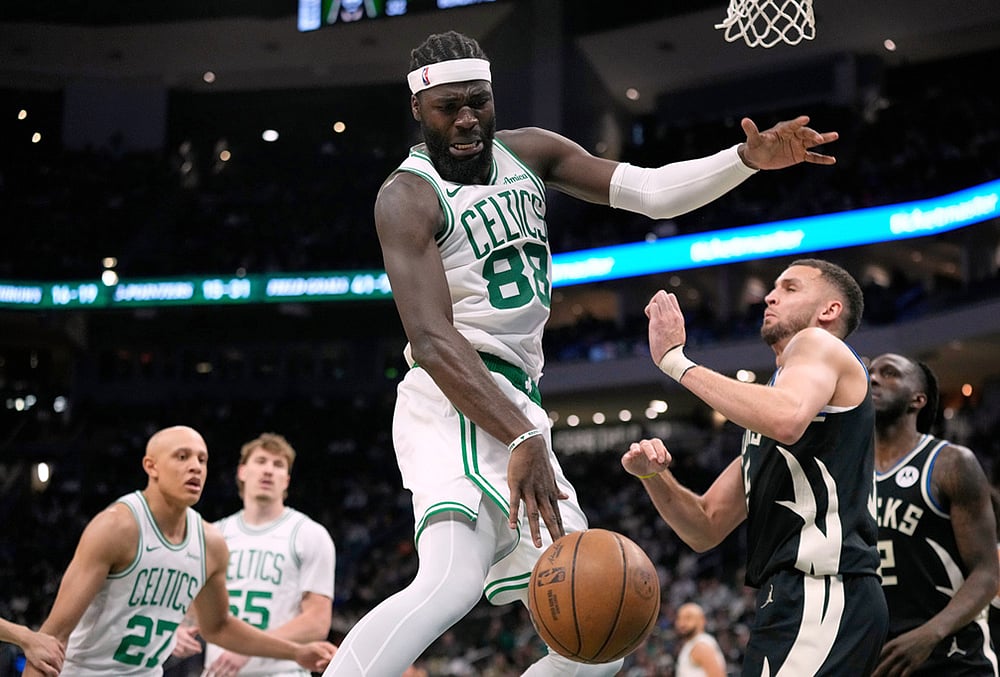 | Photo: AP/Aaron Gash : Boston Celtics Neemias Queta (88) loses control of the ball against Milwaukee Bucks Pete Nance during the second half of an NBA basketball game in Milwaukee.