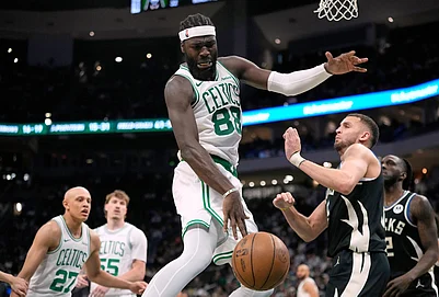 | Photo: AP/Aaron Gash : Boston Celtics Neemias Queta (88) loses control of the ball against Milwaukee Bucks Pete Nance during the second half of an NBA basketball game in Milwaukee.
