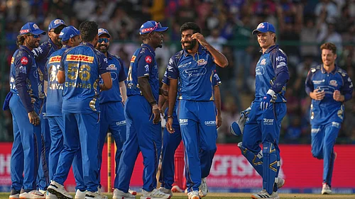 (AP Photo/Manish Swarup) : Mumbai Indians Jasprit Bumrah and teammates celebrate the dismissal of Delhi Capitals Nitish Rana during the Indian Premier League cricket match between Delhi Capitals and Mumbai Indians in New Delhi, India, Saturday, April. 4, 2026.