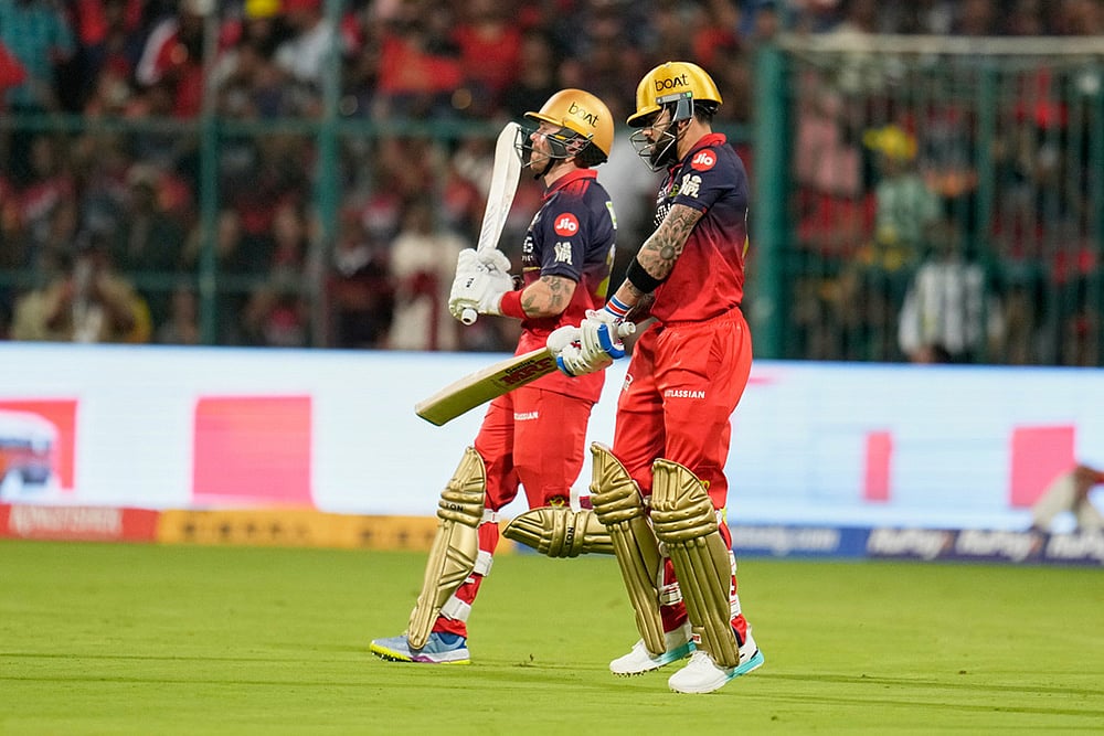 | Photo: AP/Aijaz Rahi : Royal Challengers Bengalurus Virat Kohli, right, and batting partner Phil Salt step out onto the field for the Indian Premier League cricket match between Chennai Super Kings and Royal Challengers Bengaluru in Bengaluru, India.