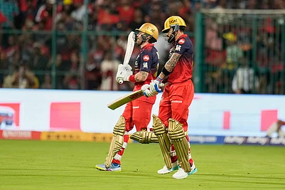 | Photo: AP/Aijaz Rahi : Royal Challengers Bengalurus Virat Kohli, right, and batting partner Phil Salt step out onto the field for the Indian Premier League cricket match between Chennai Super Kings and Royal Challengers Bengaluru in Bengaluru, India.