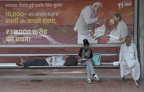 by Tribhuvan Tiwari : A Poster displaying Indian Prime Minister Narendra Modi at Bus Stand in New Delhi.
