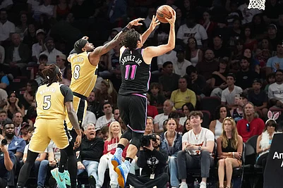 | Photo: AP/Marta Lavandier : Miami Heat forward Jaime Jaquez Jr. (11) aims to score as Washington Wizards guard Jaden Hardy (8) defends during the first half of an NBA basketball game in Miami.
