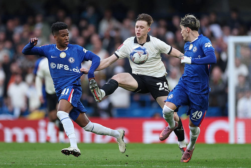 | Photo: AP/Ian Walton : Port Vales Kyle John, centre, in action against Chelseas Estevao, left, and Chelseas Alejandro Garnacho during the English FA Cup quarterfinal soccer match between Chelsea and Port Vale in London, England.