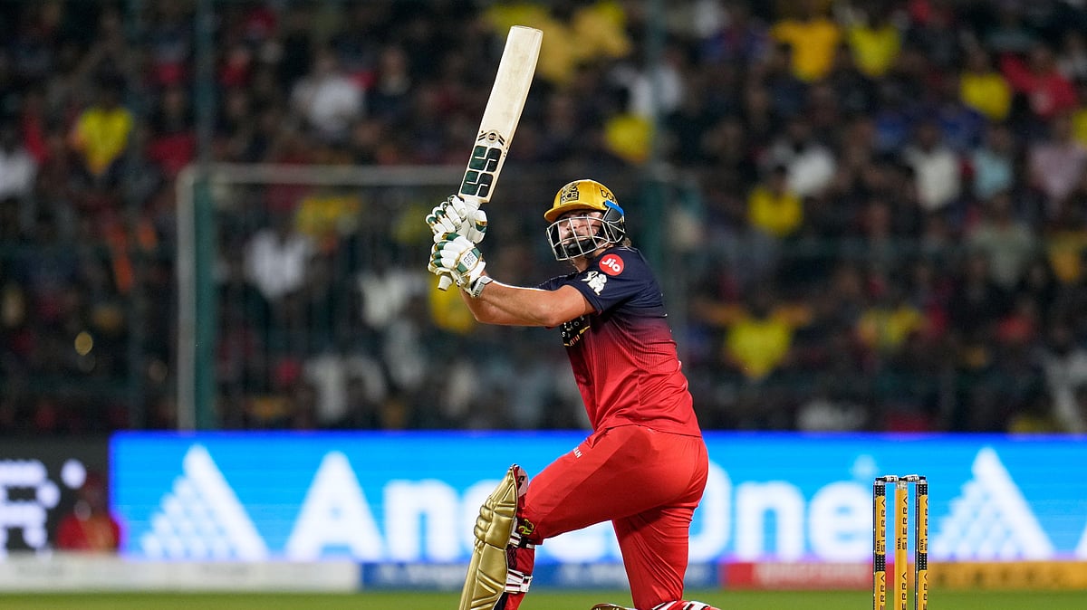 (AP Photo/Aijaz Rahi) : Royal Challengers Bengalurus Tim David plays a shot during the Indian Premier League cricket match between Chennai Super Kings and Royal Challengers Bengaluru in Bengaluru, India, Sunday, April 5, 2026.