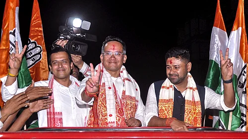 Photo: PTI : Assam Congress chief and candidate from Jorhat constituency Gaurav Gogoi, centre, and Assam Jatiya Parishad (AJP) Lurinjyoti Gogoi, right, during a roadshow in support of Congress candidate from New Guwahati constituency Santanu Bora ahead of the state Assembly elections, in Guwahati, Friday, April 3, 2026.