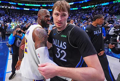 | Photo: AP/LM Otero : Dallas Mavericks forward Cooper Flagg (32) and Los Angeles Lakers forward LeBron James (23) hug at the end of their NBA basketball game in Dallas.