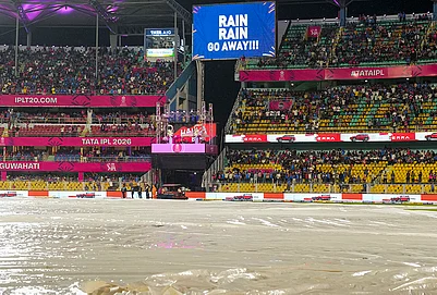 | Photo: PTI/Swapan Mahapatra : View of the ground covered due to rain during an Indian Premier League (IPL) 2026 T20 cricket match between Rajasthan Royals and Mumbai Indians, in Guwahati.