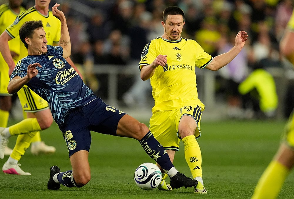 | Photo: AP/George Walker IV : Nashville SC midfielder Alex Muyl (19) kicks the ball past Club America midfielder Rodrigo Dourado, left, during the second half of an CONCACAF Champions Cup first leg quarterfinal soccer match in Nashville, Tennessee. 