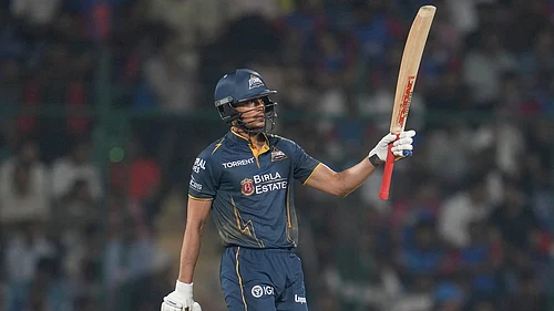 AP/Manish Swarup : Gujarat Titans captain Shubman Gill celebrates his fifty runs during the Indian Premier League match between Delhi Capitals and Gujarat Titans in New Delhi.