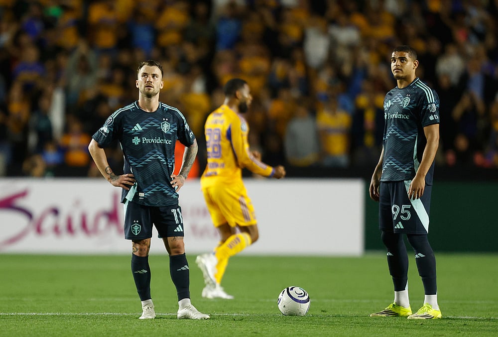 | Photo: AP/Jorge Mendoza : Albert Rusnak, left, and Osaze De Rosario of the United States Seattle Sounders stand on the pitch during a CONCACAF Champions Cup quarterfinal first leg soccer match against Mexicos Tigres in Monterrey, Mexico.