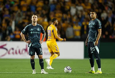 | Photo: AP/Jorge Mendoza : Albert Rusnak, left, and Osaze De Rosario of the United States Seattle Sounders stand on the pitch during a CONCACAF Champions Cup quarterfinal first leg soccer match against Mexicos Tigres in Monterrey, Mexico.