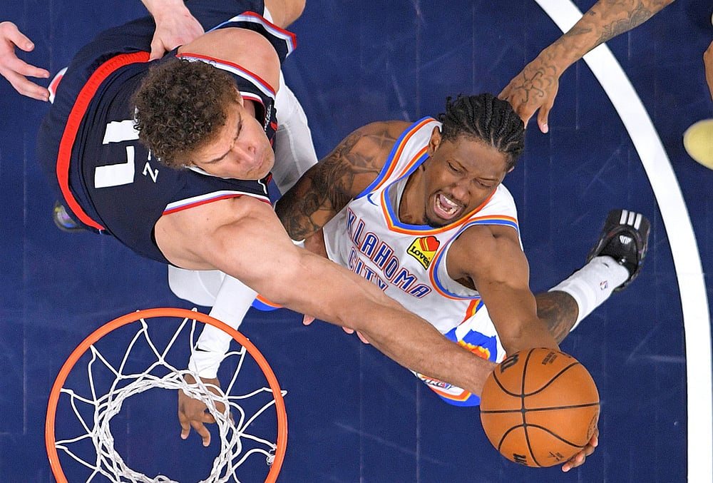 | Photo: AP/Mark J. Terrill : Oklahoma City Thunder guard Jalen Williams, right, shoots as Los Angeles Clippers center Brook Lopez defends during the second half of an NBA basketball game in Inglewood, California.