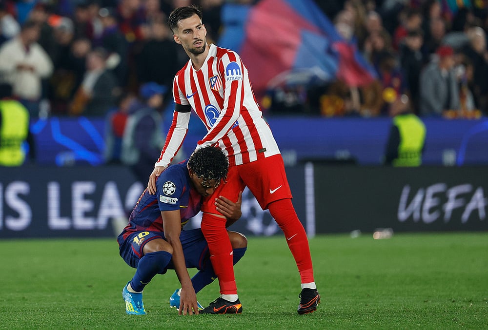 | Photo: AP/Joan Monfort : Atletico Madrids Alex Baena comforts Barcelonas Lamine Yamal after the Champions League quarterfinal first leg soccer match between Barcelona and Atletico Madrid in Barcelona, Spain.