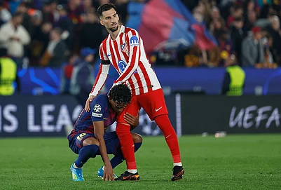 | Photo: AP/Joan Monfort : Atletico Madrids Alex Baena comforts Barcelonas Lamine Yamal after the Champions League quarterfinal first leg soccer match between Barcelona and Atletico Madrid in Barcelona, Spain.