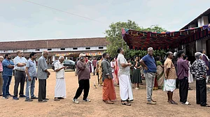 Photo: AP/ R S Iyer : People queue up to vote outside a polling booth during the Kerala state election in Kochi, India, Thursday, April 9, 2026.