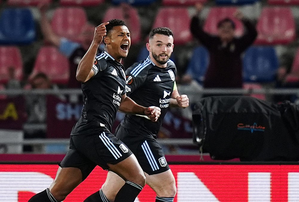 | Photo: Massimo Paolone/LaPresse via AP : Aston Villas Ollie Watkins, left, celebrates scoring during the Europa League soccer match between Bologna and Aston Villa in Bologna, Italy.
