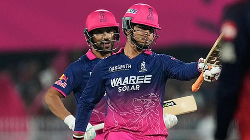 AP/Anupam Nath : Rajasthan Royals Vaibhav Sooryavanshi celebrates his fifty runs during the Indian Premier League match against Royal Challengers Bengaluru in Guwahati.