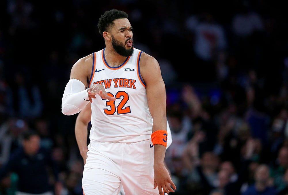 | Photo: AP/John Munson : New York Knicks center Karl-Anthony Towns reacts after making a 3-point basket during the second half of an NBA basketball game against the Boston Celtics in New York. 