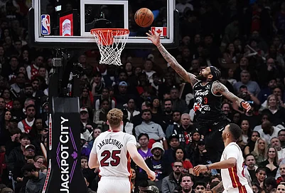 | Photo: Nathan Denette/The Canadian Press via AP : Toronto Raptors Brandon Ingram (3) scores as Miami Heats Kasparas Jakucionis (25) and Norman Powell (24) look on during the second half of an NBA basketball game in Toronto.