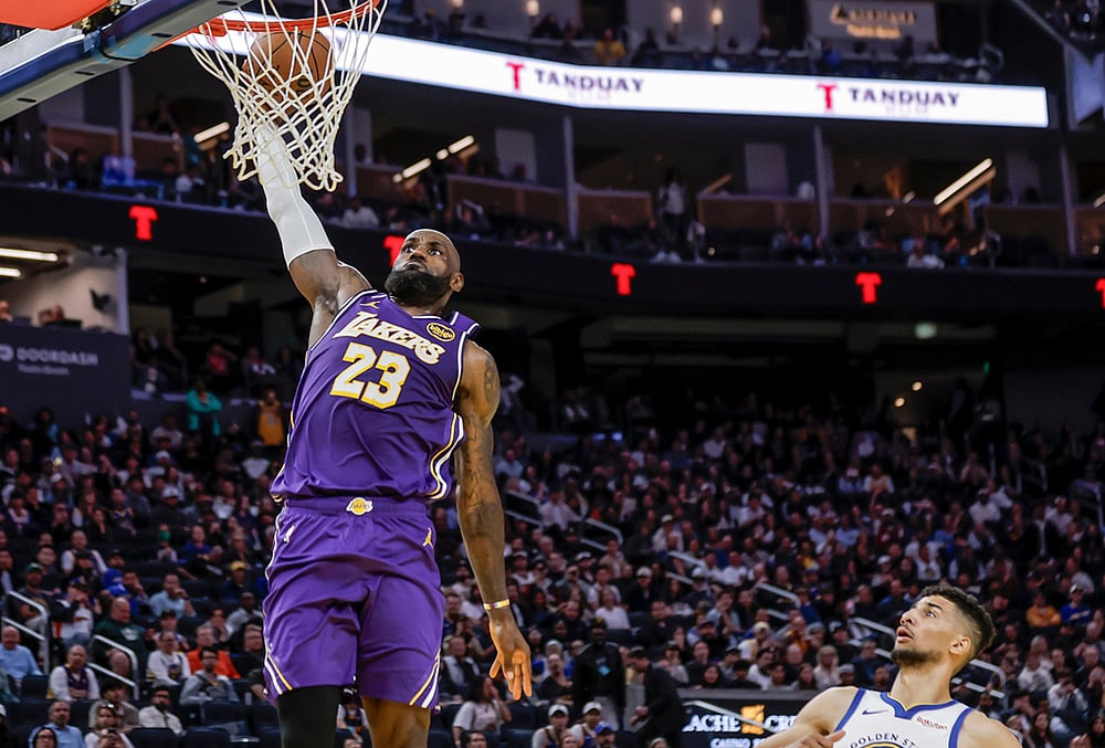| Photo: Carlos Avila Gonzalez/San Francisco Chronicle via AP : LeBron James (23) dunks in the second half as the Golden State Warriors played the Los Angeles Lakers at Chase Center in San Francisco.