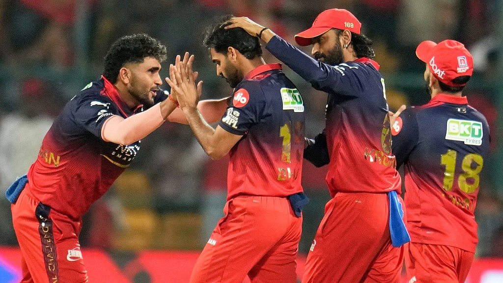 Aijaz Rahi : Royal Challengers Bengalurus Bhuvneshwar Kumar, second left, celebrates with teammates the wicket of Chennai Super Kings Ayush Mhatre during their Indian Premier League match in Bengaluru.