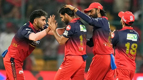 Aijaz Rahi : Royal Challengers Bengalurus Bhuvneshwar Kumar, second left, celebrates with teammates the wicket of Chennai Super Kings Ayush Mhatre during their Indian Premier League match in Bengaluru.