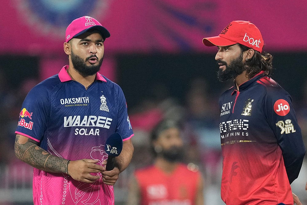 | Photo: AP/Anupam Nath : Rajasthan Royals captain Riyan Parag, left talks with Royal Challengers Bengalurus captain Rajat Patidar prior to the coin toss of the Indian Premier League cricket match between Royal Challengers Bengaluru and Rajasthan Royals in Guwahati, India.