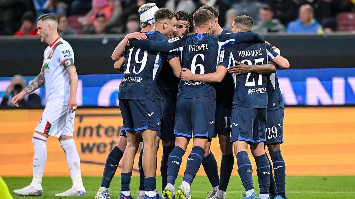 | Photo: dpa/Harry Langer via AP : Hoffenheim's Bazoumana Toure celebrates with teammates after scoring during the German Bundesliga soccer match between FC Augsburg and TSG 1899 Hoffenheim in Augsburg, Germany, Friday, April 10, 2026.