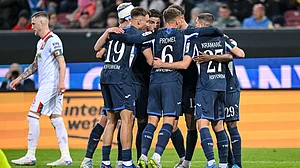 | Photo: dpa/Harry Langer via AP : Hoffenheim's Bazoumana Toure celebrates with teammates after scoring during the German Bundesliga soccer match between FC Augsburg and TSG 1899 Hoffenheim in Augsburg, Germany, Friday, April 10, 2026.
