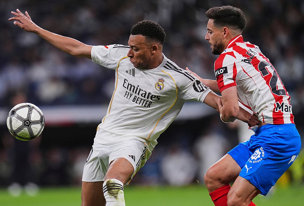 | Photo: AP/Manu Fernandez : Real Madrids Kylian Mbappe, left, vies for the ball with Gironas Alex Moreno during a Spanish La Liga soccer match between Real Madrid and Girona in Madrid, Spain.