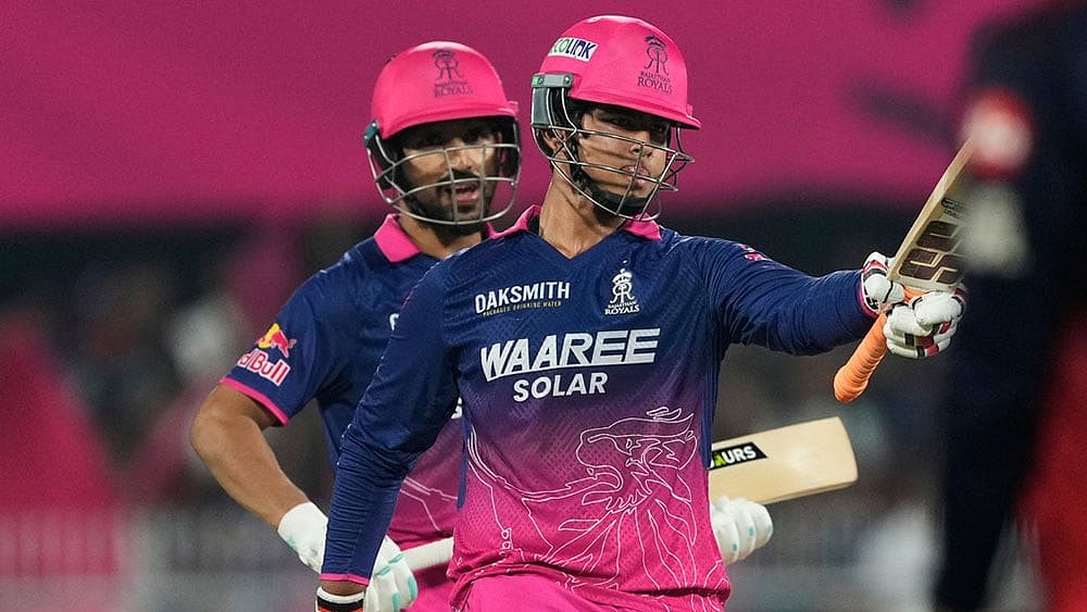 | Photo: AP/Anupam Nath : dRajasthan Royals Vaibhav Sooryavanshi celebrates his fifty runs uring the Indian Premier League cricket match between Royal Challengers Bengaluru and Rajasthan Royals in Guwahati, India.