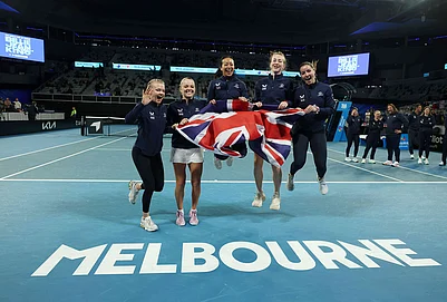 | Photo: Con Chronis/AAP Image via AP : British Billy Jean Cup tennis players Harriet Dart, Katie Swan, Anne Keothavong, Mika Stojsavljevic and Jodie Anna Burrage celebrate, Saturday, April 11, 2026, after defeating Australia in Melbourne.