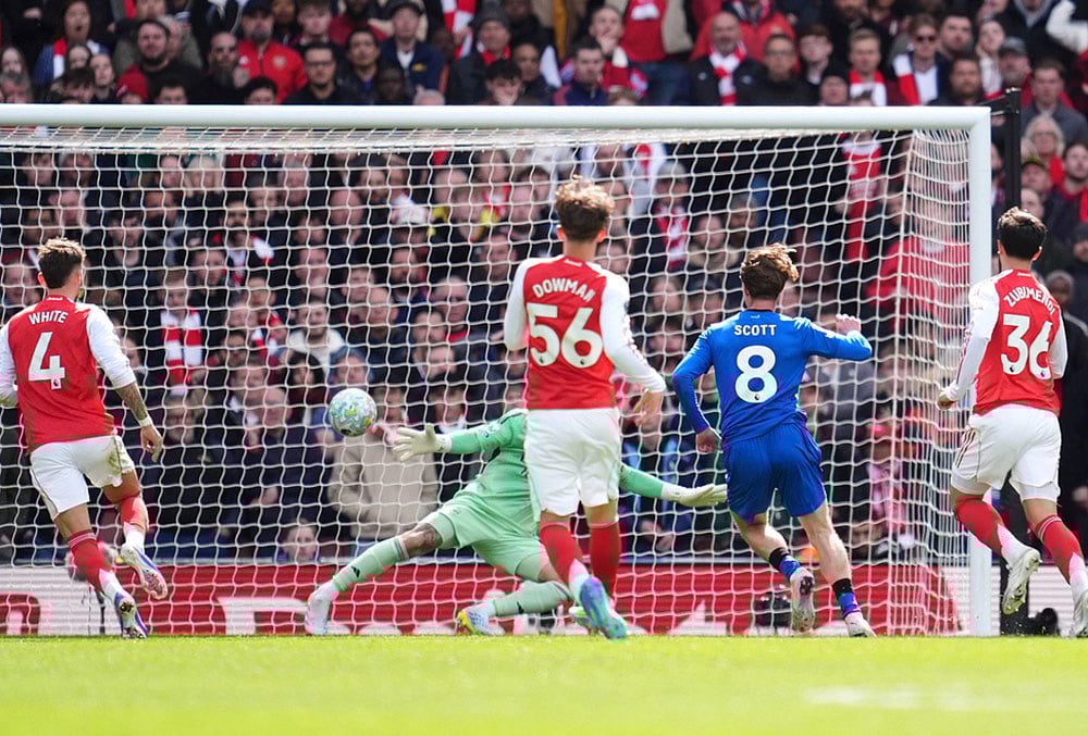 | Photo: Adam Davy/PA via AP : Bournemouths Alex Scott scores his sides second goal of the game during the English Premier League soccer match between Arsenal and Bournemouth in London, England. 