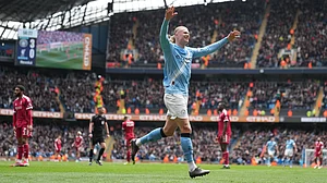 | Photo: AP/Jon Super : Manchester City's Erling Haaland celebrates after scoring his third goal during the FA Cup quarter-final soccer match between Manchester City and Liverpool in Manchester, England, Saturday, April 4, 2026.
