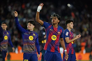 | Photo: AP/Joan Monfort : Barcelona's Lamine Yamal, centre, and Barcelona's Xavi Espart, left, celebrate after the Spanish La Liga soccer match between Barcelona and Espanyol in Barcelona, Spain.