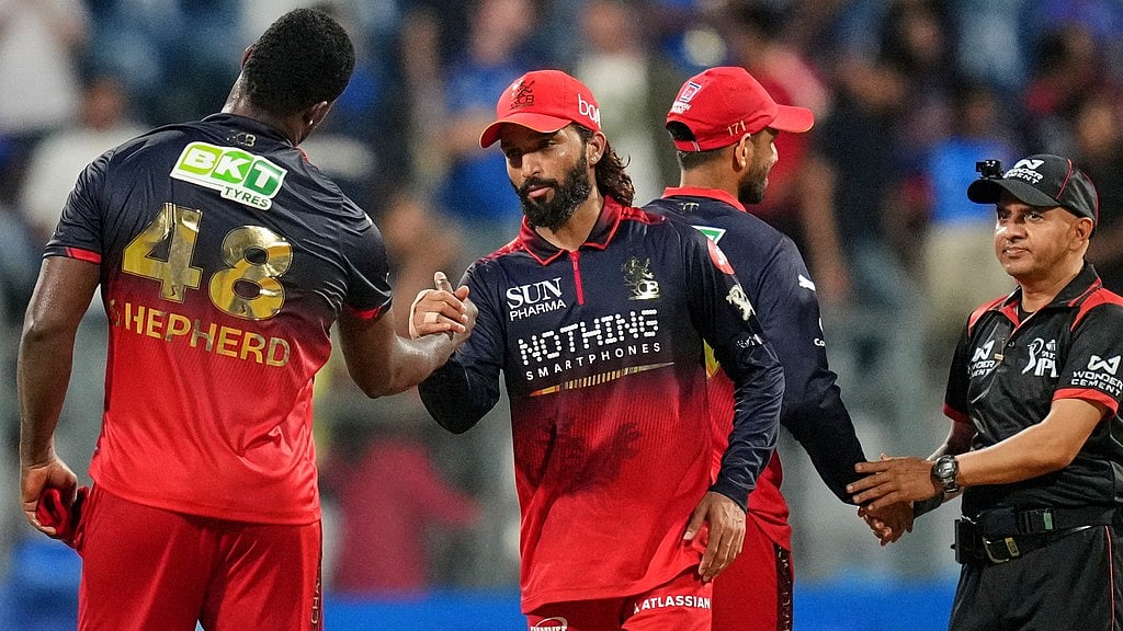 AP Photo/Rafiq Maqbool : Royal Challengers Bengalurus Devdutt Padikkal with teammates celebrate the win over Royal Challengers Bengaluru during the Indian Premier League cricket match, in Mumbai , India, Sunday, April 12, 2026.