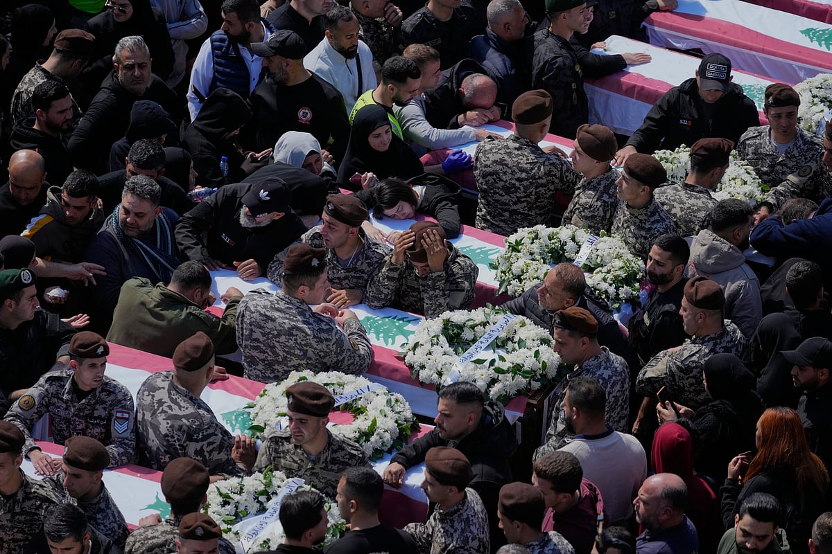 (AP Photo/Mohammed Zaatari)
Source: AP : Colleagues mourn over the coffins during the funeral of 13 state security officers killed the previous day in an Israeli strike in the Lebanese coastal city of Sidon, Saturday, April 11, 2026.