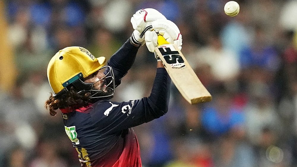 | Photo: AP/Rafiq Maqbool : Royal Challengers Bengalurus captain Rajat Patidar plays a shot during the Indian Premier League cricket match between Mumbai Indians and Royal Challengers Bengaluru, in Mumbai, India.